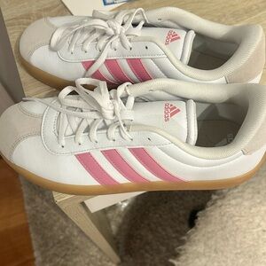 Pink and white adidas shoes